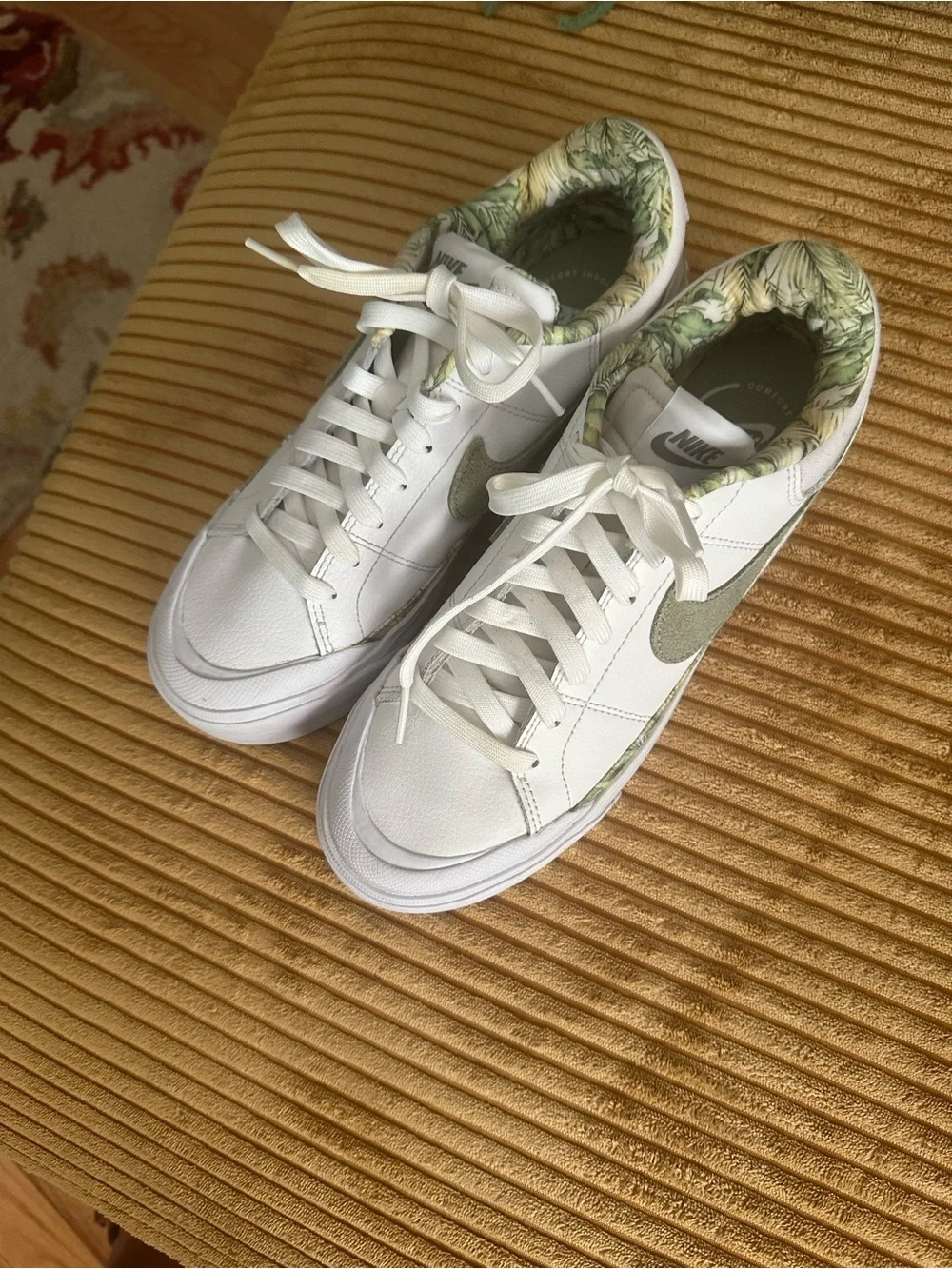 Nike Women's White Sneakers with Olive Swoosh and Leaf-Print Collar